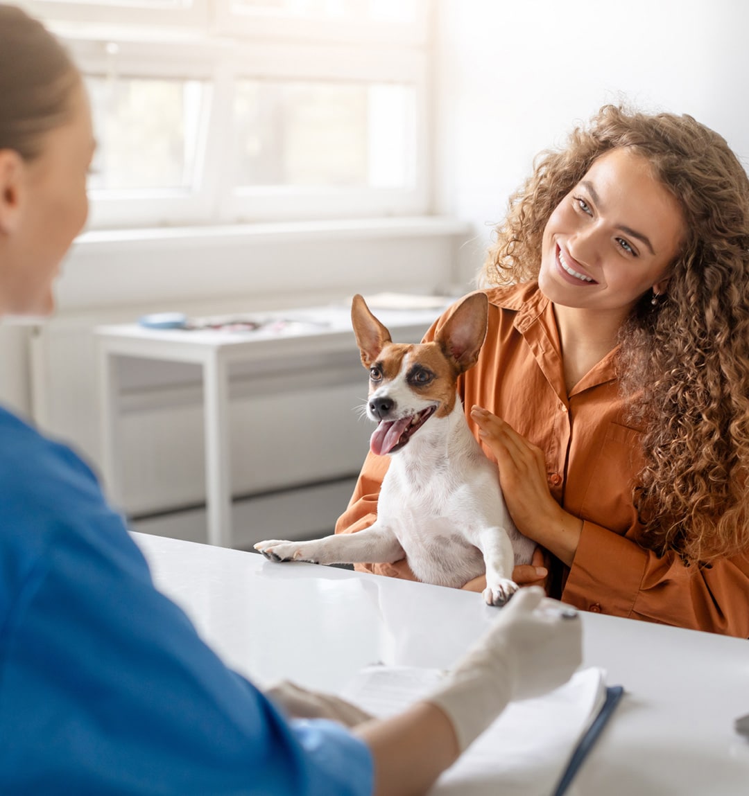 Happy dog and owner after veterinary care in Lumberton NC